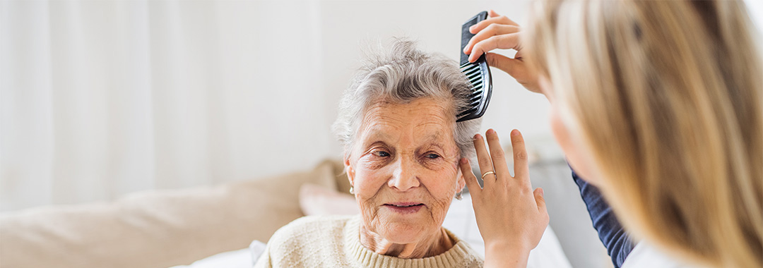 a women getting her hair brushed